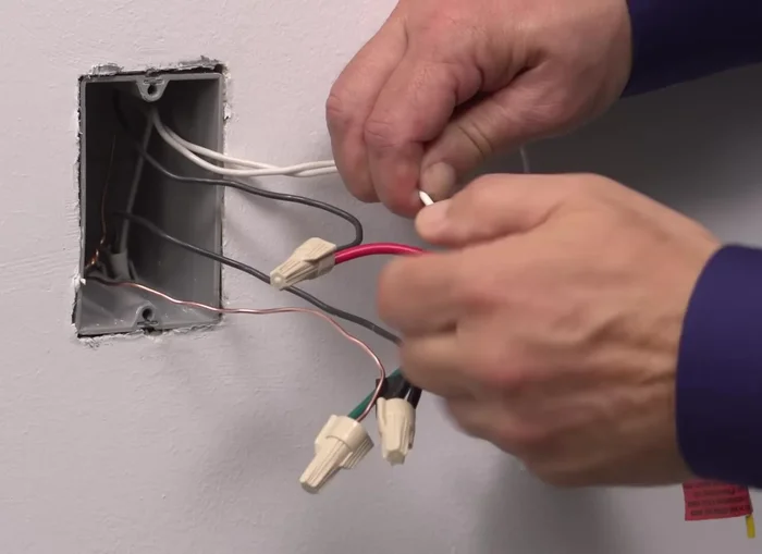 Connect the neutral wallbox wire to the white lead using a wire connector.