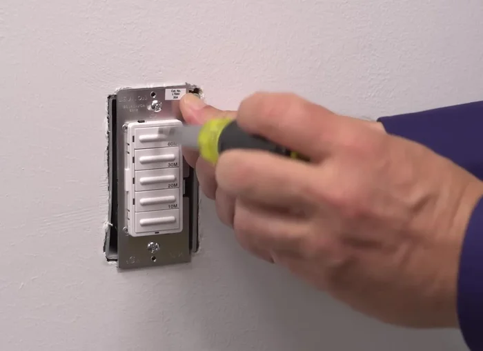 Turn off power, tighten mounting screws, and attach the wall plate. Restore power.