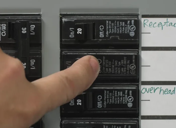 Prepare the wires for installation by removing a small piece of insulation from the pigtail leads on the timer switch and twisting the exposed stranded copper wiring clockwise.