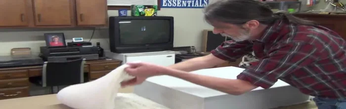 Carefully fit the new foam core into the cushion, starting from the back and working towards the front, ensuring a snug fit.