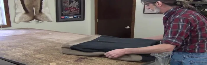 Allow the foam to expand slightly, ensuring the cover is properly aligned before fully removing the vacuum and silk film.