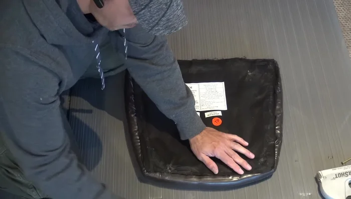 Remove the old vinyl (carefully if reusing, otherwise pry it off).