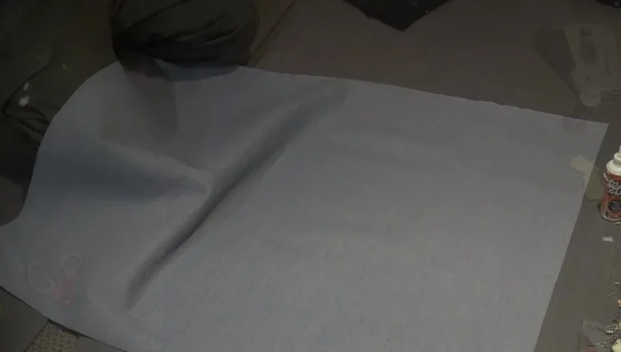 Stretch the corners tightly to remove wrinkles and staple.