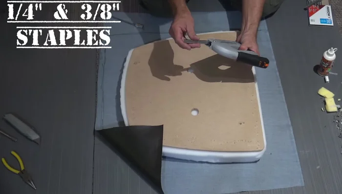 Stretch the corners tightly to remove wrinkles and staple.