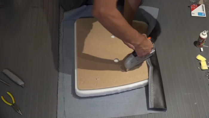 Stretch the corners tightly to remove wrinkles and staple.