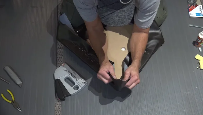 Stretch the corners tightly to remove wrinkles and staple.