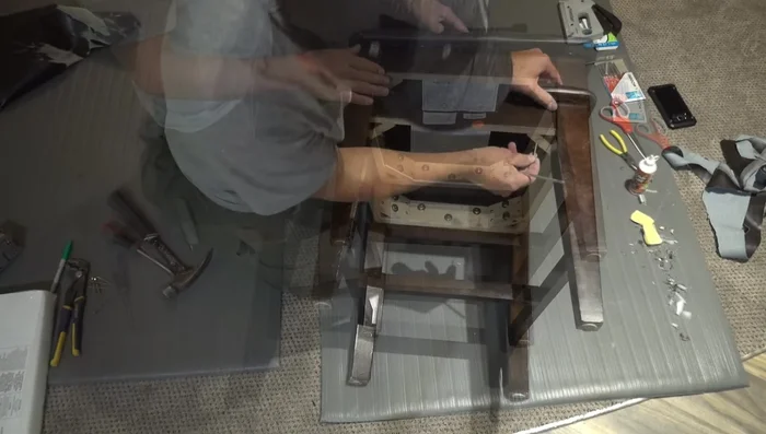 Attach the cushion to the chair frame with screws.