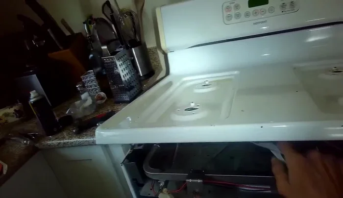 Install the new burner valve, ensuring the seal is in place. Secure with the quarter-inch screw.