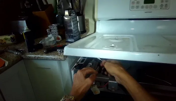 Install the new burner valve, ensuring the seal is in place. Secure with the quarter-inch screw.