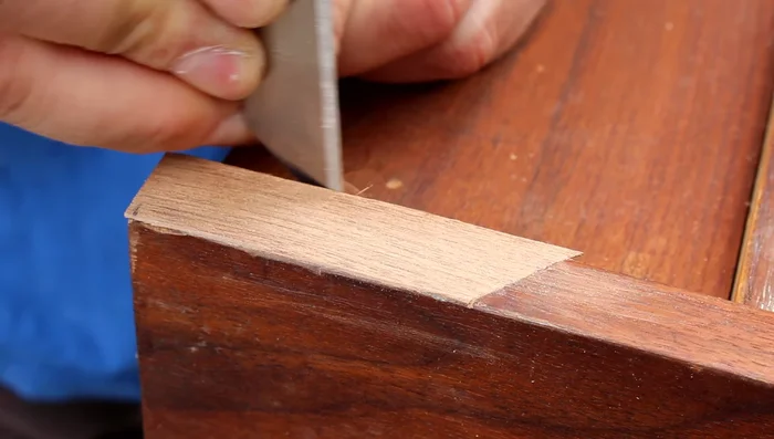 Apply stain and finish to match the existing wood (process not shown in video).