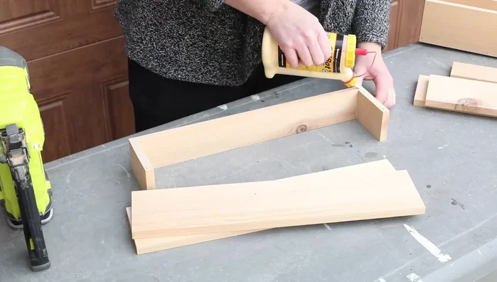 Add flower boxes and pergola: Build and attach simple cedar flower boxes and a timber portico/pergola.