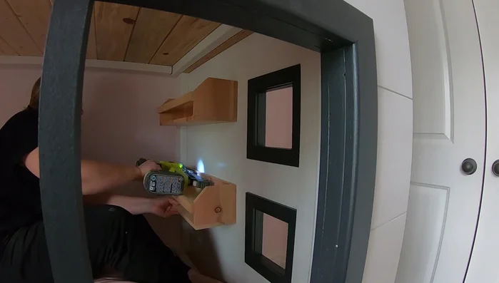 Install shelves: Add simple cedar shelves at the foot of the bed.