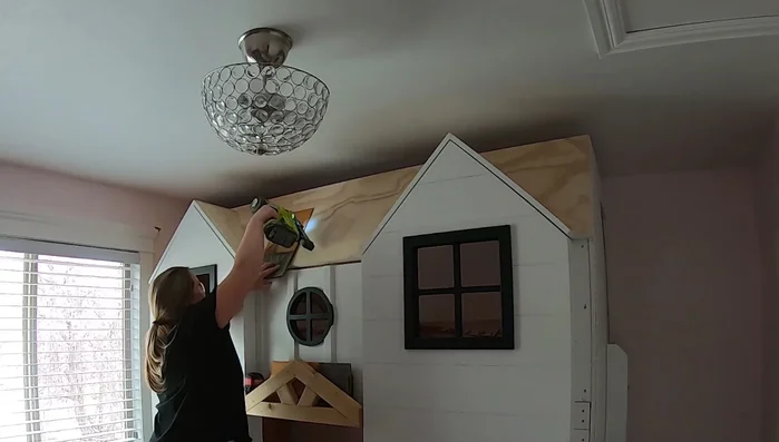 Install roof shingles: Add weathered cedar shingles to the roof.