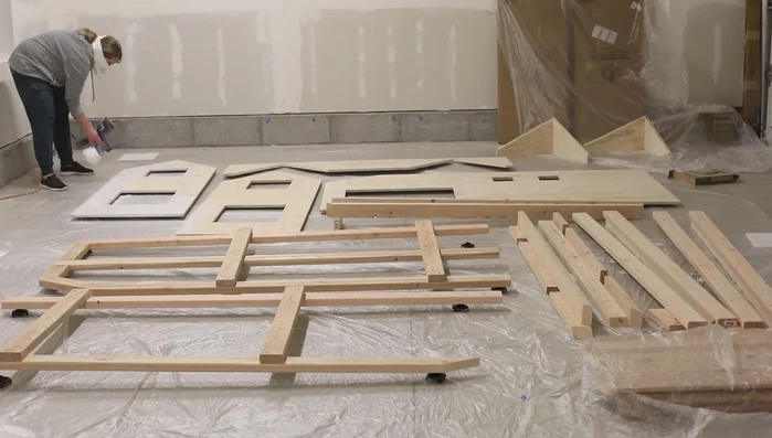 Prime and paint: Apply two coats of primer, sanding between coats, followed by a coat of satin finish paint to all pieces.