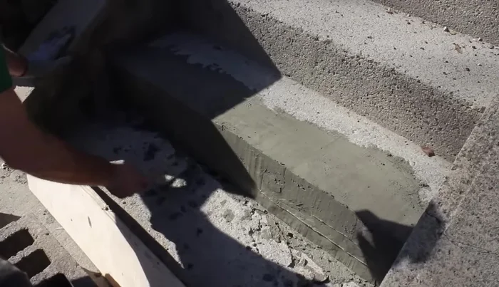 Round the edges of the new step using an edging tool.