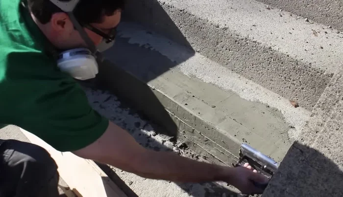 Round the edges of the new step using an edging tool.