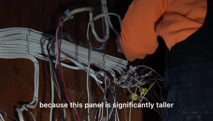 Mount the new Square D panel.