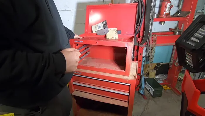 Weld the drawer fronts to the slide plates.