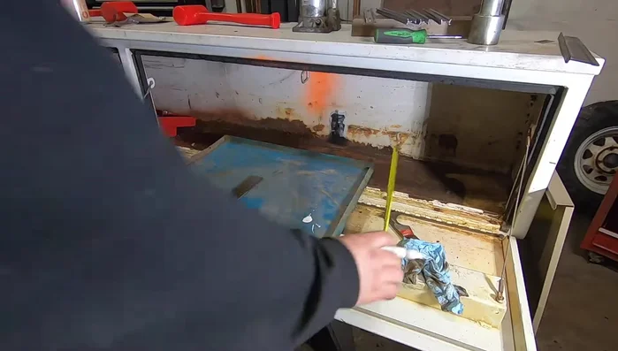 Weld the drawer fronts to the slide plates.