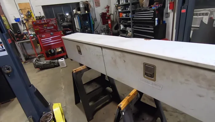 Acquire two used 8-foot weather guard tool boxes from a junkyard.