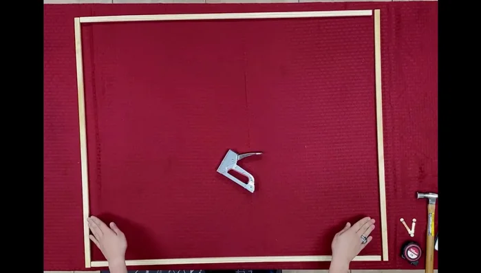 Assemble the wooden frame by stapling the 35-inch pieces inside the 41-inch pieces.