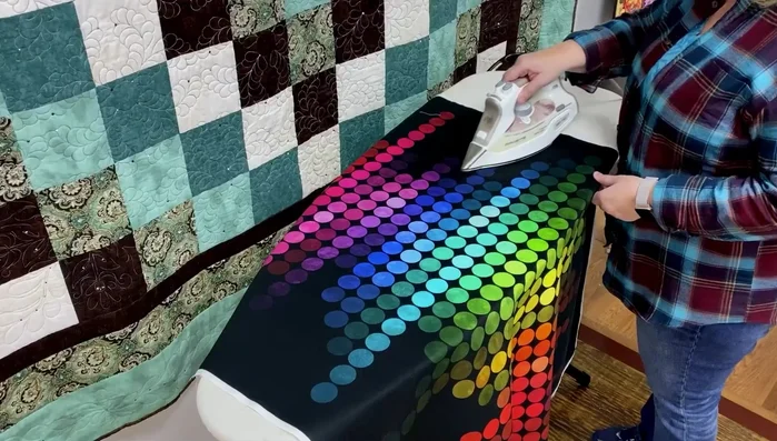 Iron the fabric panel.