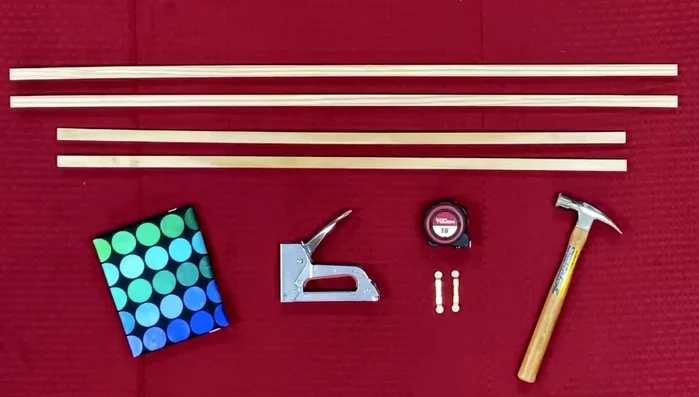 Assemble the wooden frame by stapling the 35-inch pieces inside the 41-inch pieces.