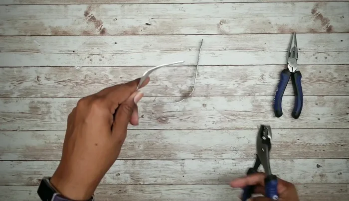 Attach a small piece of craft stick to the fork handle using E6000 and hot glue, then paint it black.