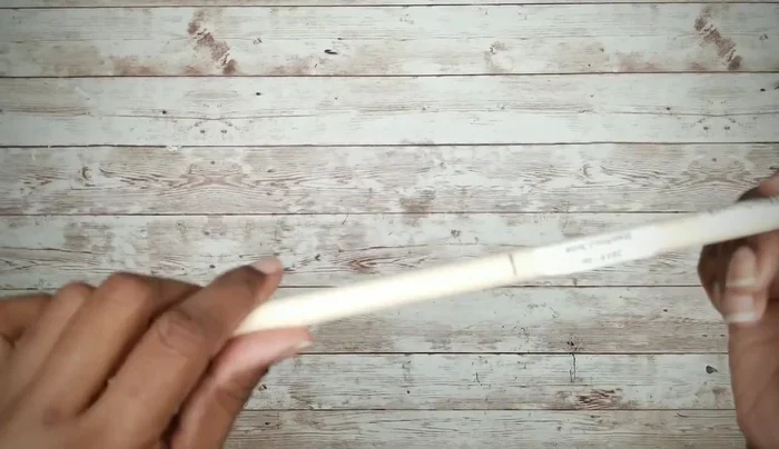 Attach the dowel rod wheels to the cutouts and smooth the edges.