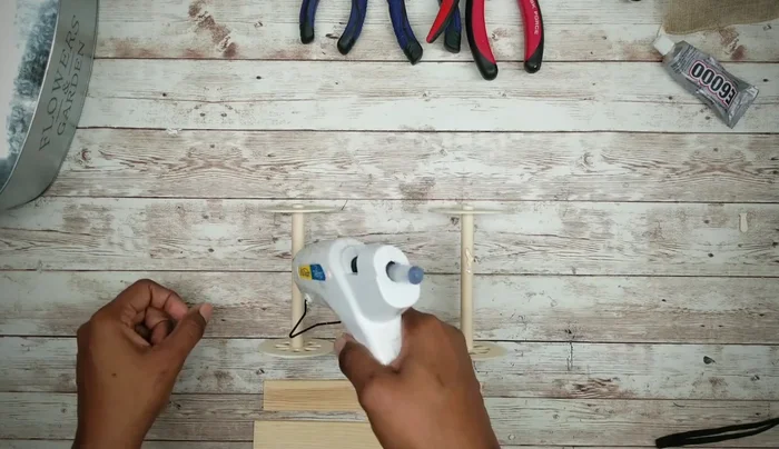 Spray paint the wheel base with flat black paint and let it dry thoroughly.