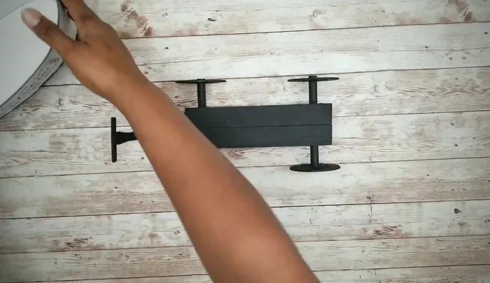 Attach the completed wheel base to the planter.