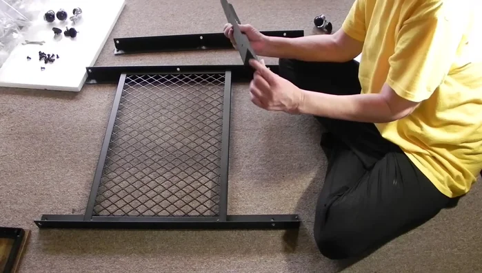 Attaching side braces to shelves and top: Attach the side braces to the corners of each shelf and the top. Ensure the 'closed' side faces down.