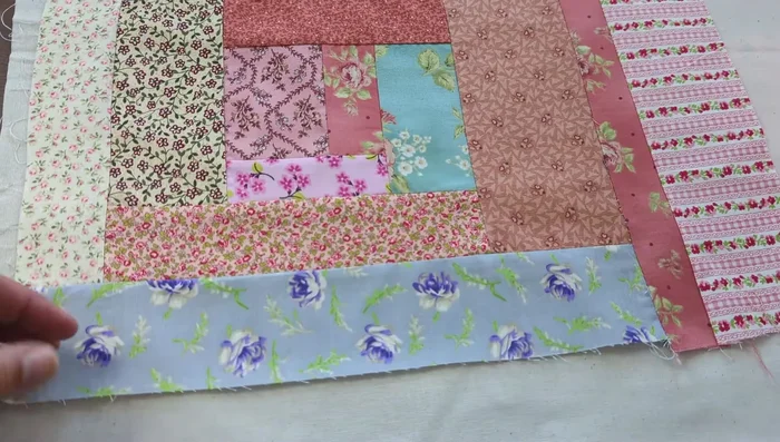 Prepare the tote bag: cut the patchwork panel and the backing fabric to the desired size.