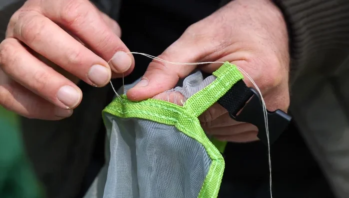 Re-insert the needle nearby to secure the first stitch.