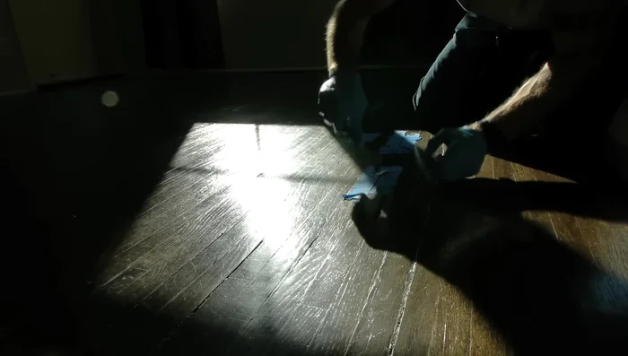 Apply the epoxy to the gouge using a putty knife, filling it as smoothly as possible. Don't worry about perfection, sanding will follow.