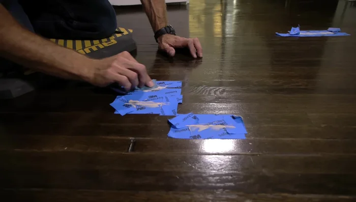 Carefully sand the edges to feather the repair into the existing wood finish, preventing harsh lines. Use 120-grit sandpaper for a smoother finish.