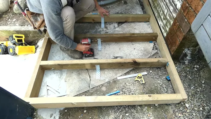 Add a right-angle bracket to the center joist for extra support.