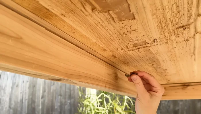 Attach the tabletop to the base using tabletop fasteners.