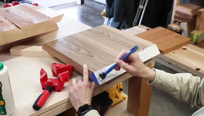 Add dowels to the corners of the cube stools using a dowel jig for strength and design.