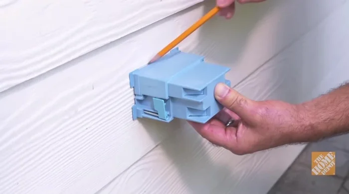 Mount outdoor GFCI box: Secure the box to the exterior wall.