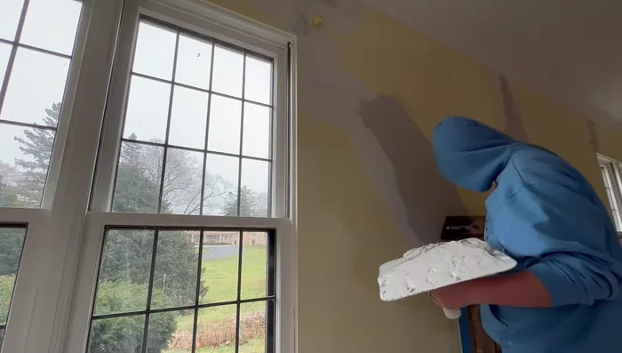 Flatten the Repair: Use a large trowel (or similar tool) to flatten the repair, creating a smooth transition with the existing wall. Avoid making it worse than it was.