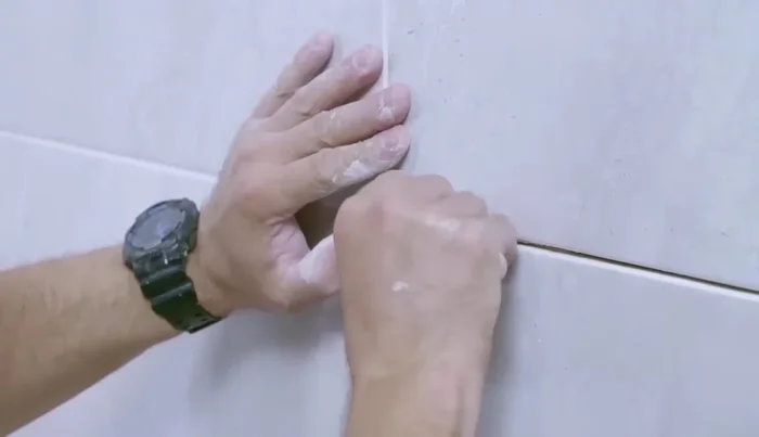 Use tile spacers to maintain even grout lines (126.079).
