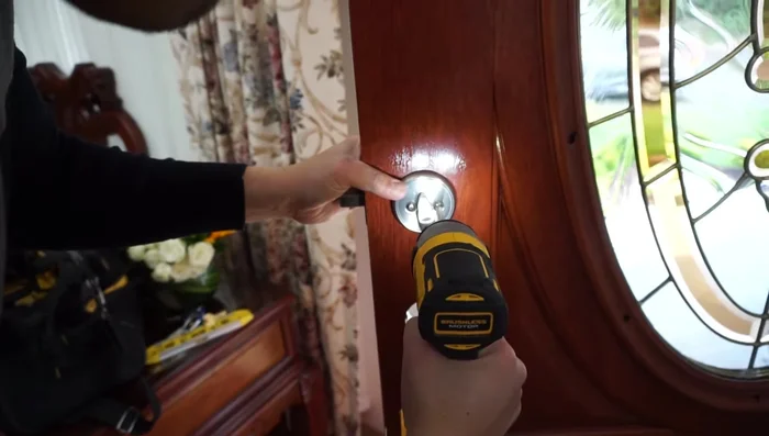 Fully tighten the deadbolt screws.