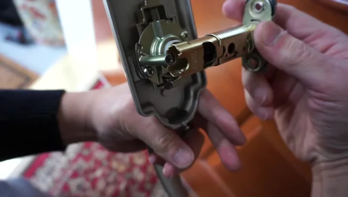 If necessary, drill a hole for the latch mechanism (ensure you tape the other side of the door to prevent blowouts).