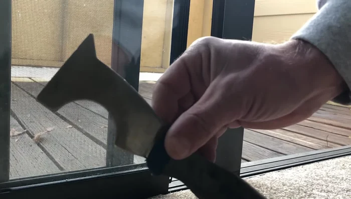 Remove the old wheel using the putty knife or pry bar.