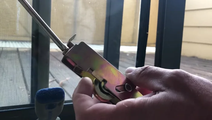 Gently tap the frame back onto the glass using a rubber mallet and a block of wood.