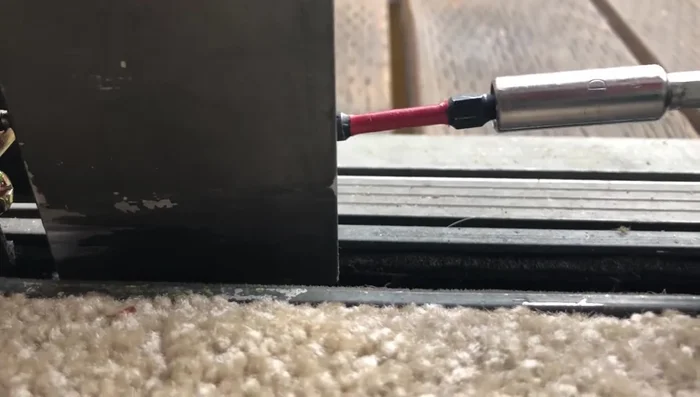 Gently tap the frame back onto the glass using a rubber mallet and a block of wood.