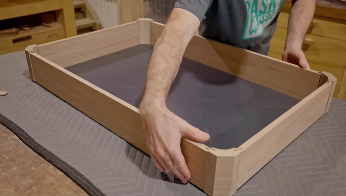 Cut rebates on both sides of the cabinet for panels (back and door).