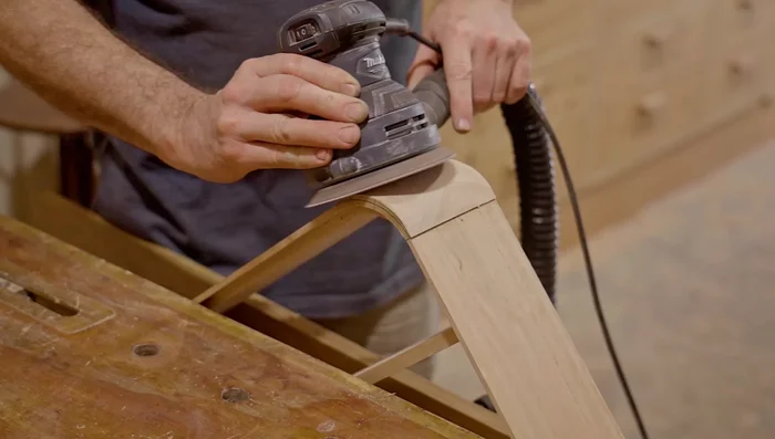 Shape the outside corners using an orbital sander.