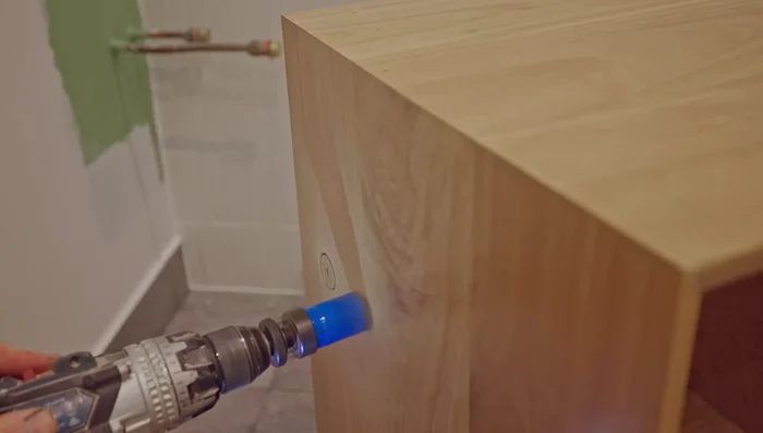 Install the vanity and sink (steps not detailed).